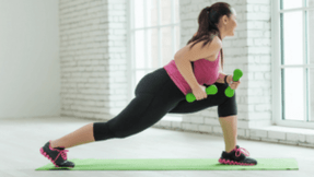 Girl exercises with dumbbells