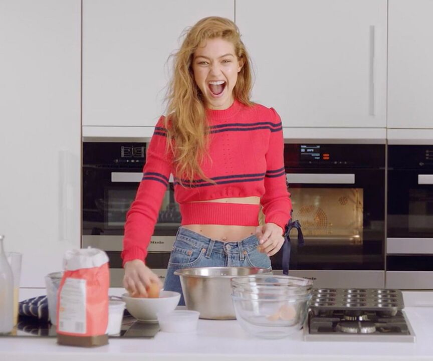 Slim girl prepares healthy breakfast for herself